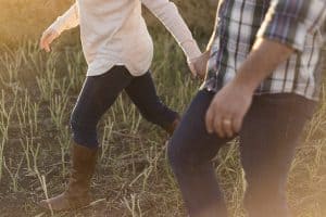 couple walking in the grass