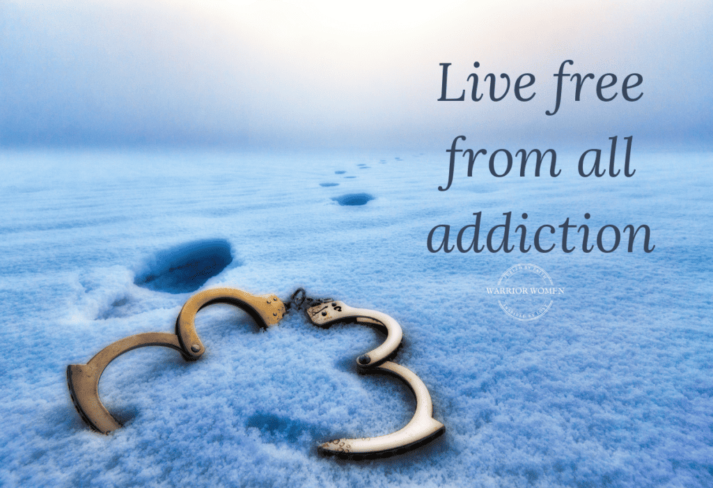 blue sand with footprints walking away from open handcuffs prayer to live free from addiction