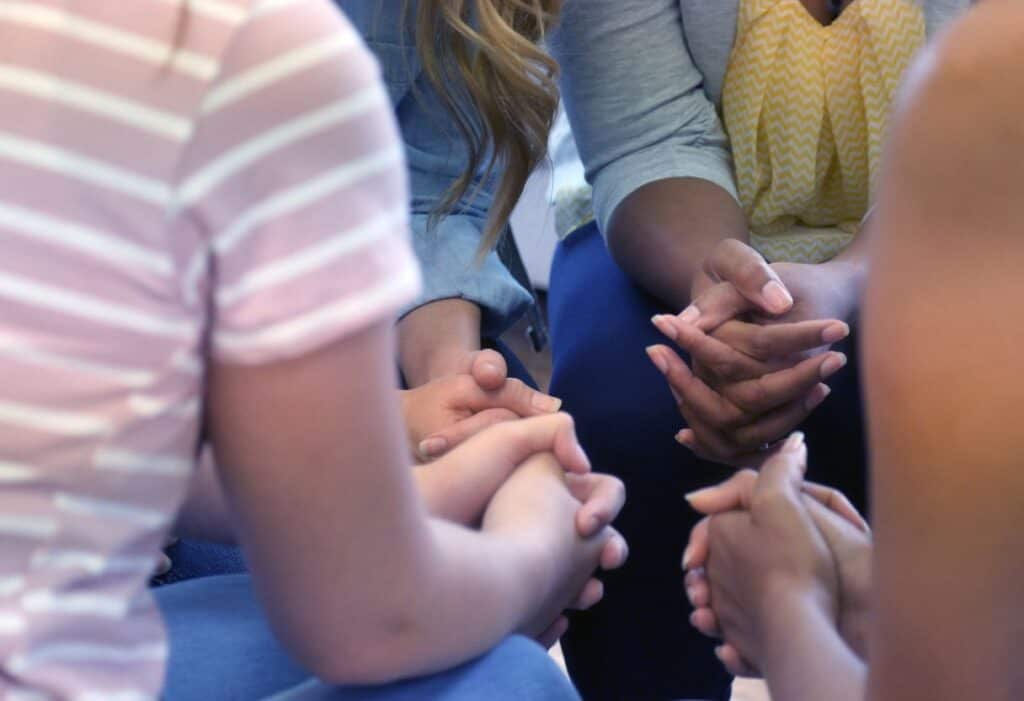 group of women praying together