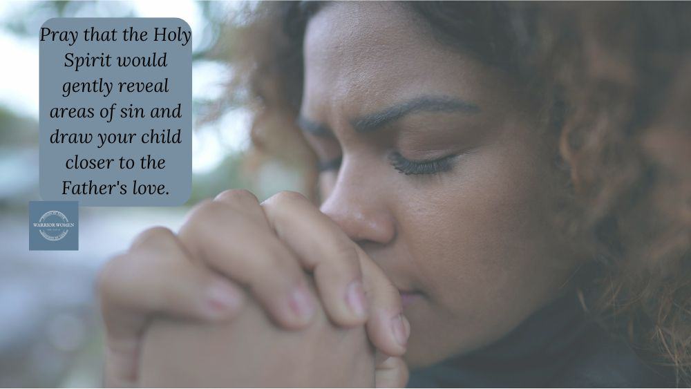 Pray for prodigals: Woman praying with hands clasped in front of her.