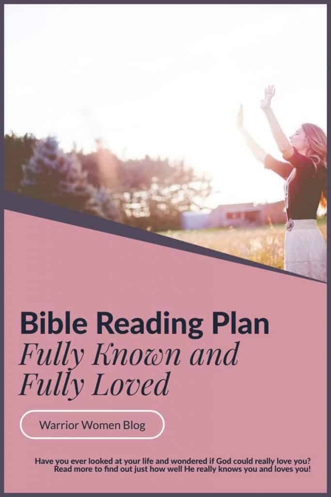 woman standing outside with arms raised toward the sky