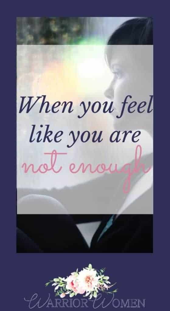 feeling like you are not enough? woman looking out a window