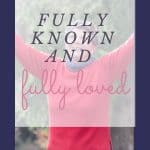 Woman looking up with arms lifted up toward sky